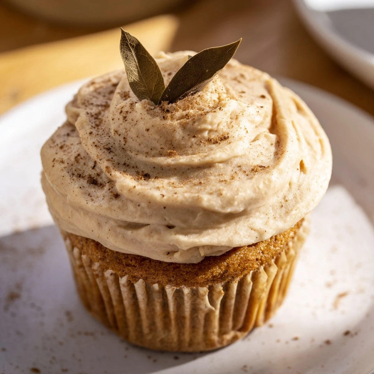 Warm chai-spiced latte cupcakes, beautifully frosted and inviting for dessert or teatime enjoyment.