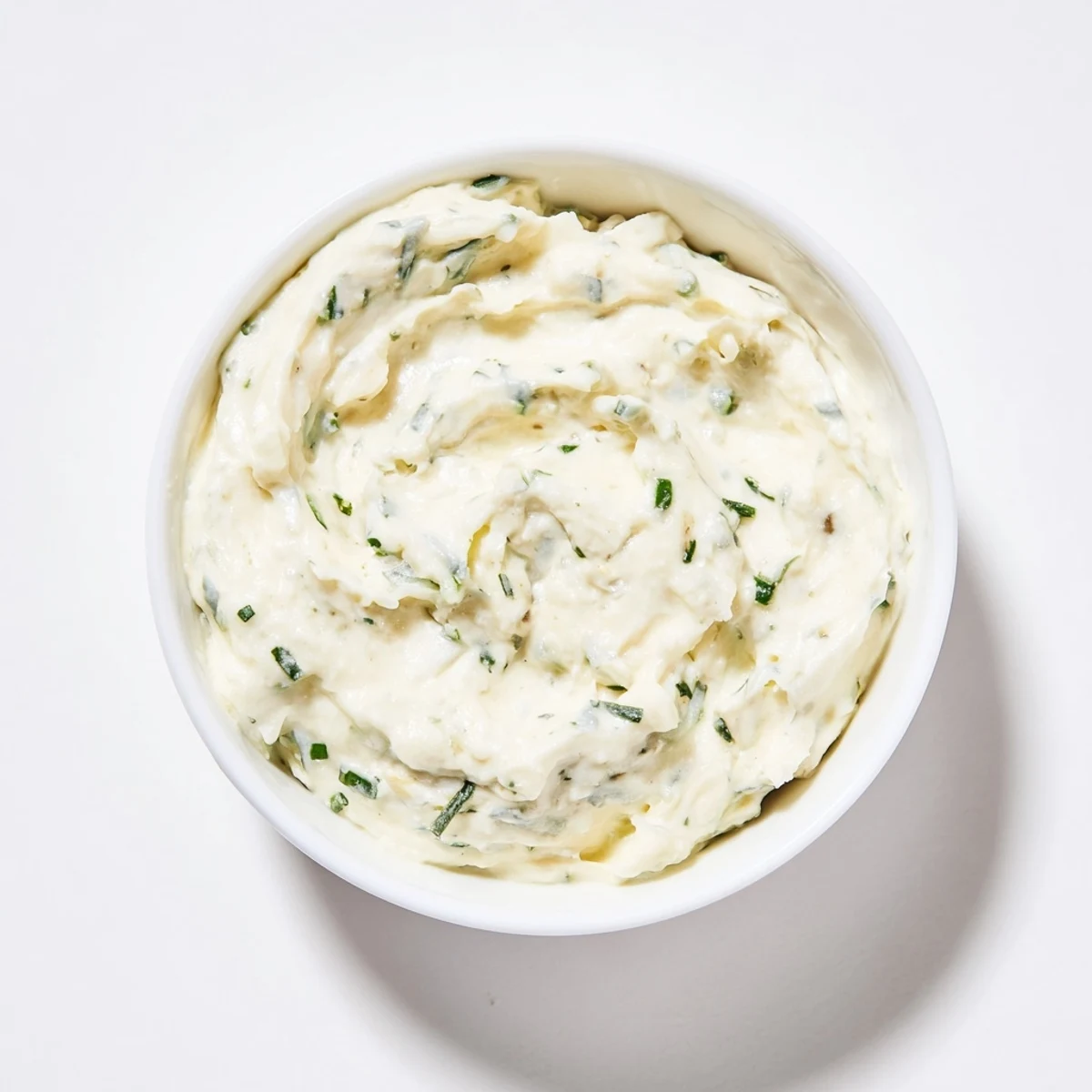 Homemade garlic dip, thick and rich with fresh herbs, is perfect for dipping or spreading.