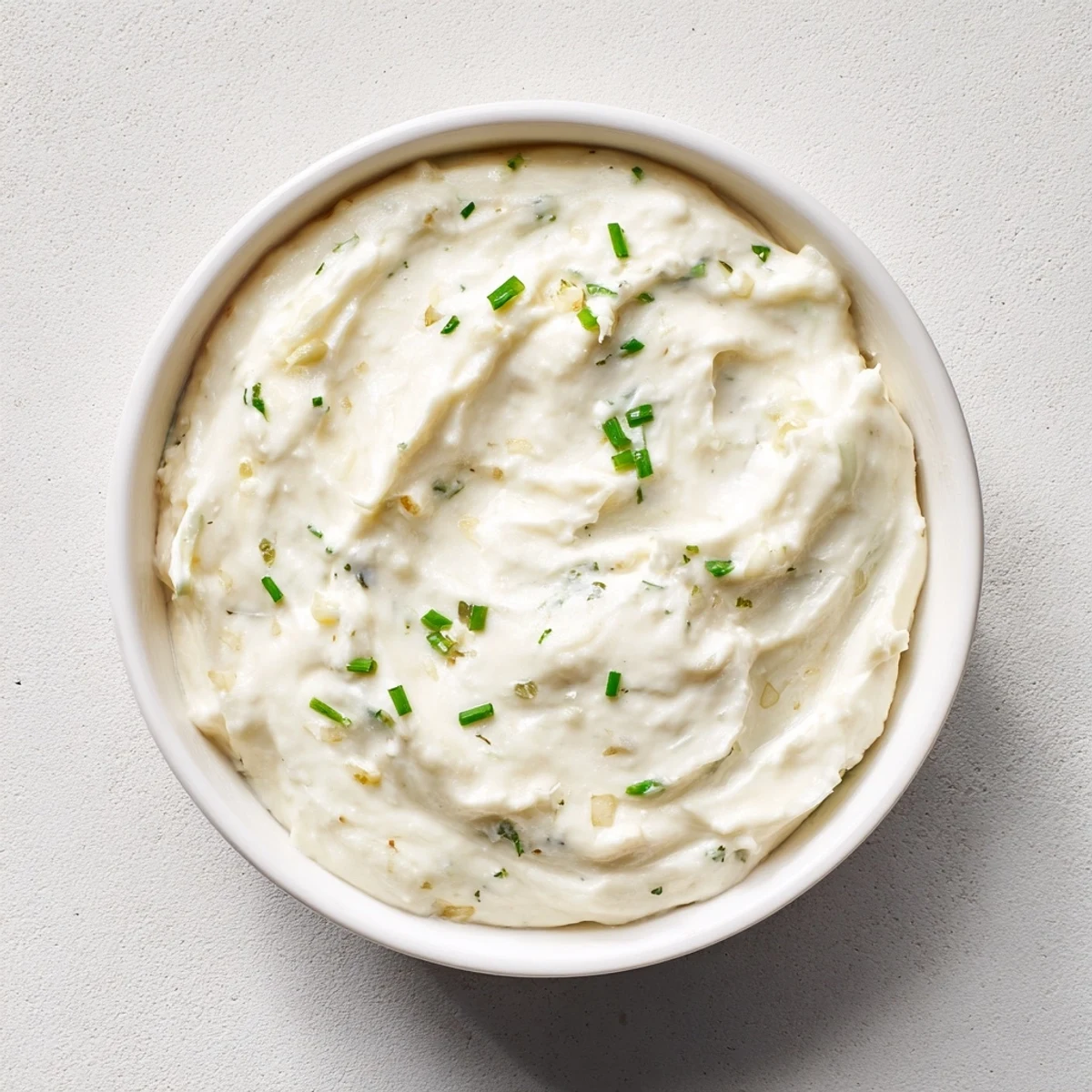 This easy garlic dip recipe features a vibrant white color, ready for a party.