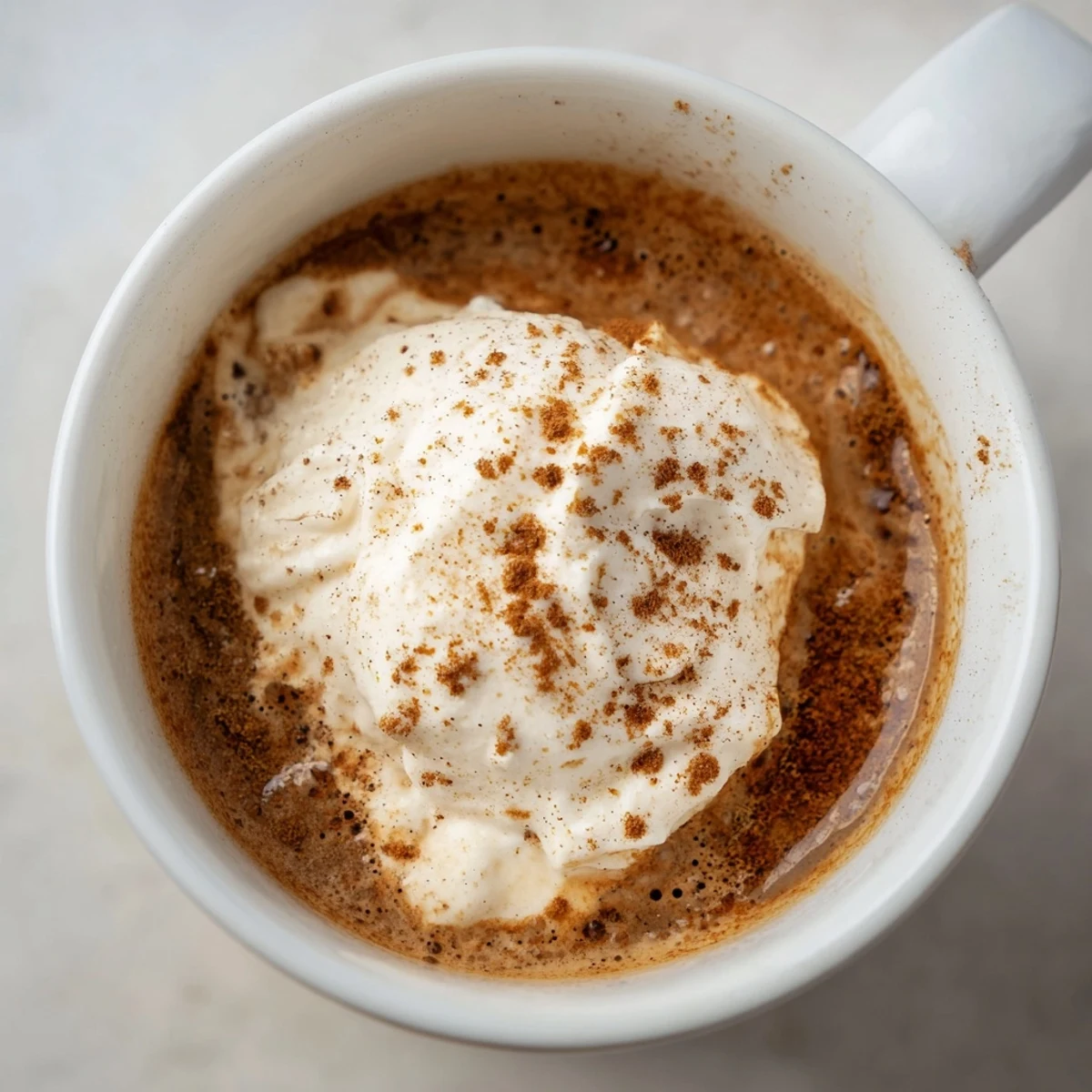 Richly spiced Gingerbread Spiced Coffee with a swirl of milk—imagine the delicious aroma!