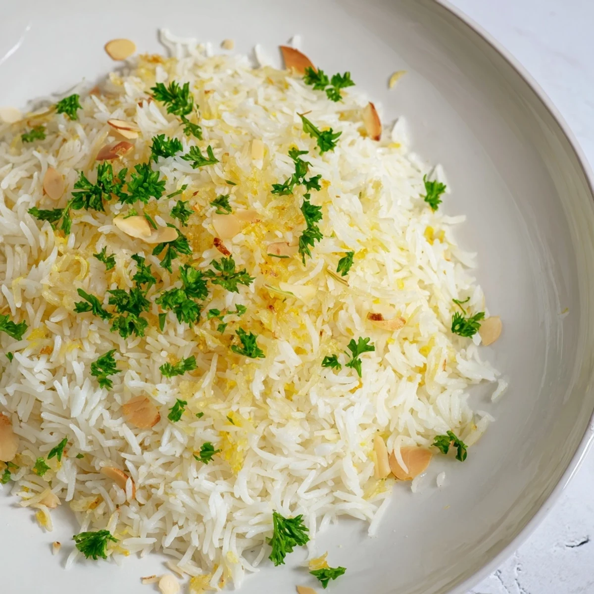 Fluffy, Middle Eastern-style rice pilaf sprinkled with fresh parsley and crunchy almonds, delicious!