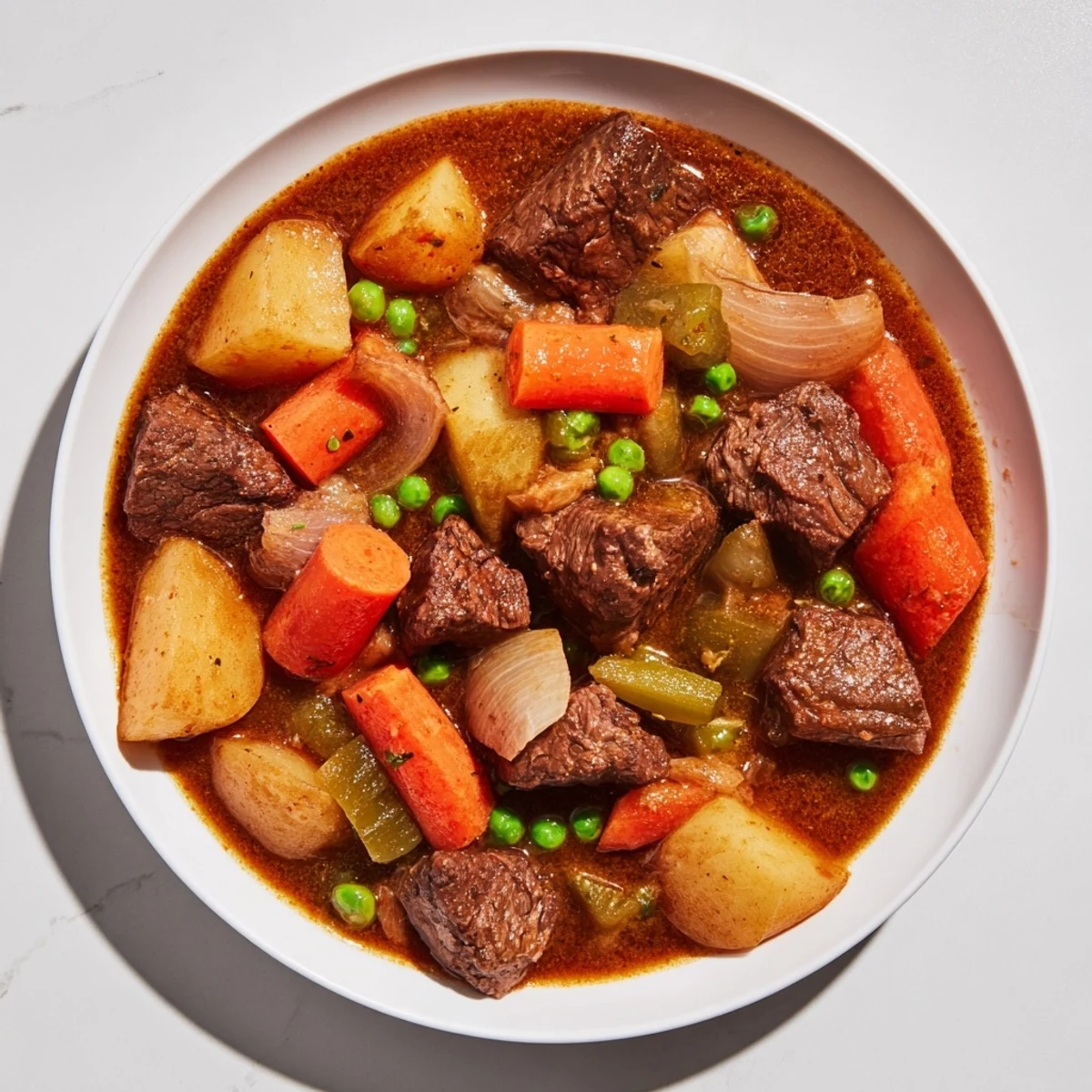 Hearty beef stew simmering in a Dutch oven with vegetables, ready for a warm meal.