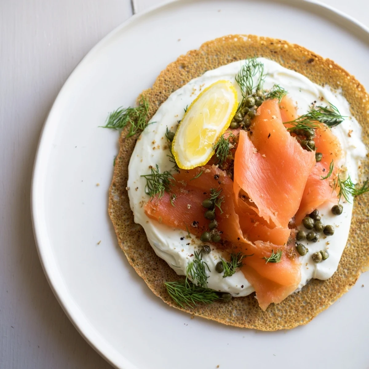 Enjoy this elegant Smoked Salmon and Cream Cheese Blinis appetizer; imagine the creamy cheese and smoky salmon.