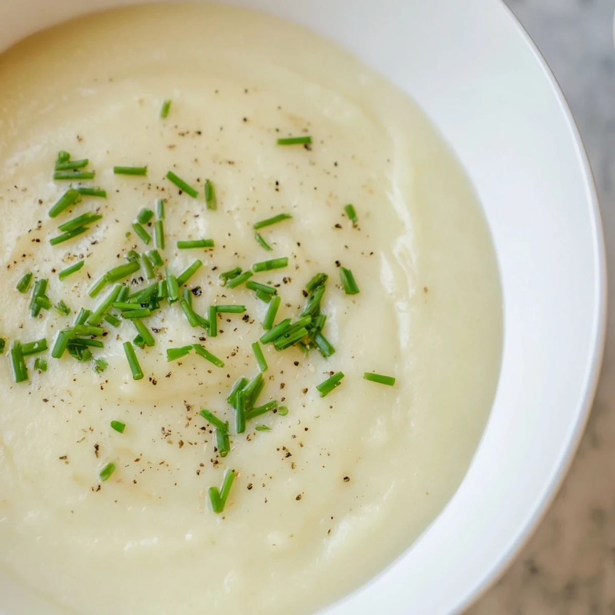 Velvety smooth Creamy Leek and Potato Soup: a warm, comforting bowl perfect for a chilly evening.