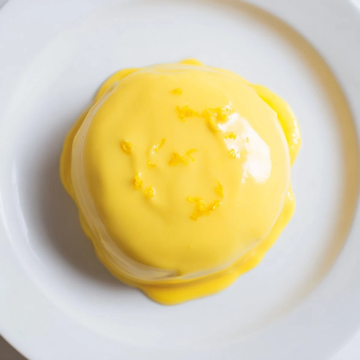 Vibrant, sunshine-yellow zesty lemon curd, a perfect topping for scones and breakfast treats.