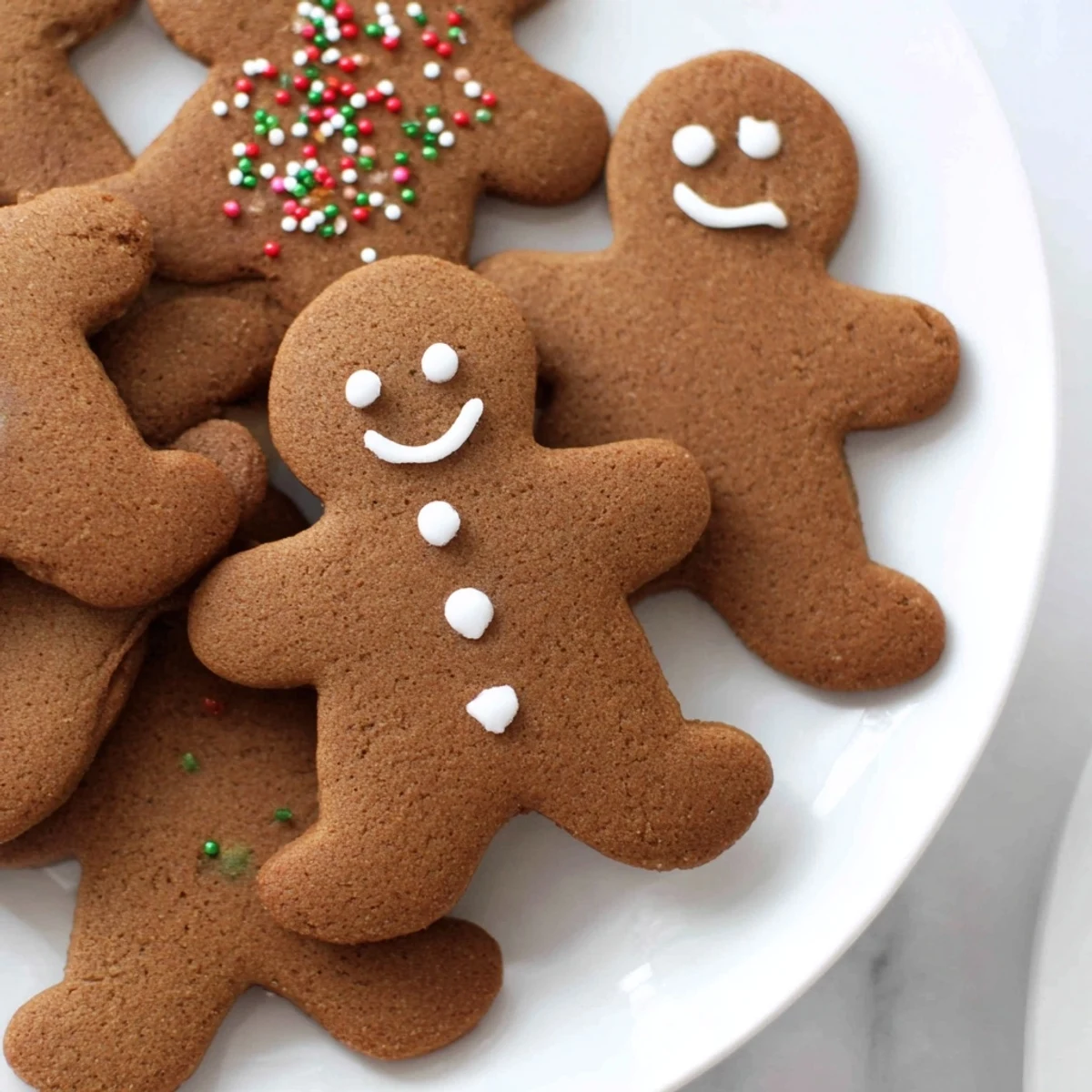 Warm and spicy gingerbread men cookies, freshly baked and ready for holiday decorating fun.