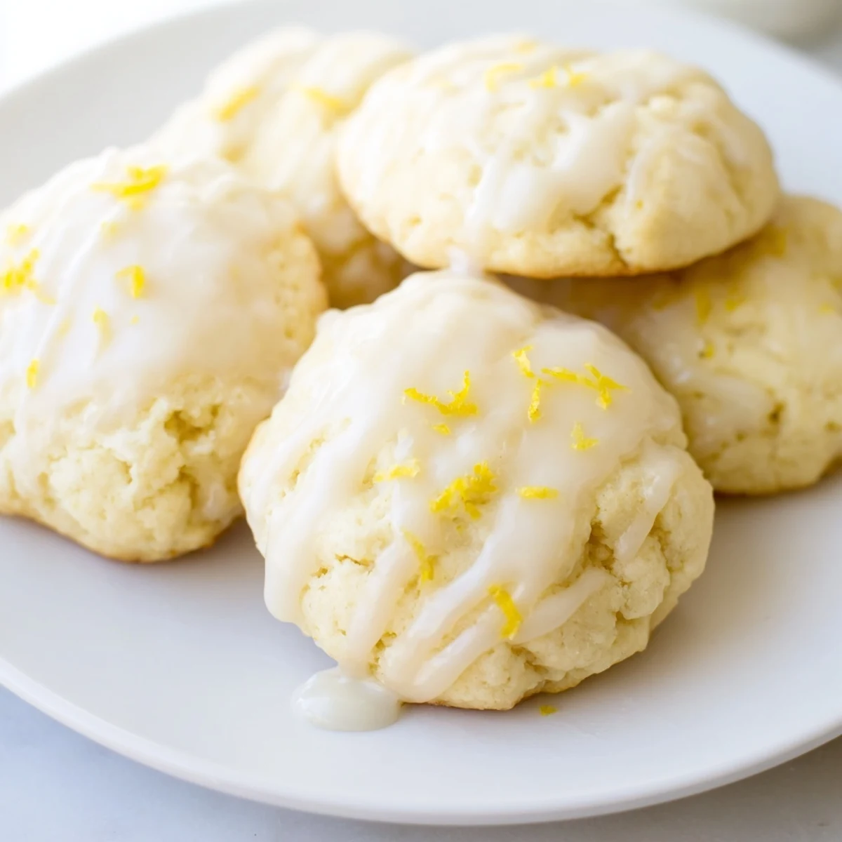 Fluffy Lemon Ricotta Cookies drizzled with sweet lemon glaze, ready for an afternoon treat.