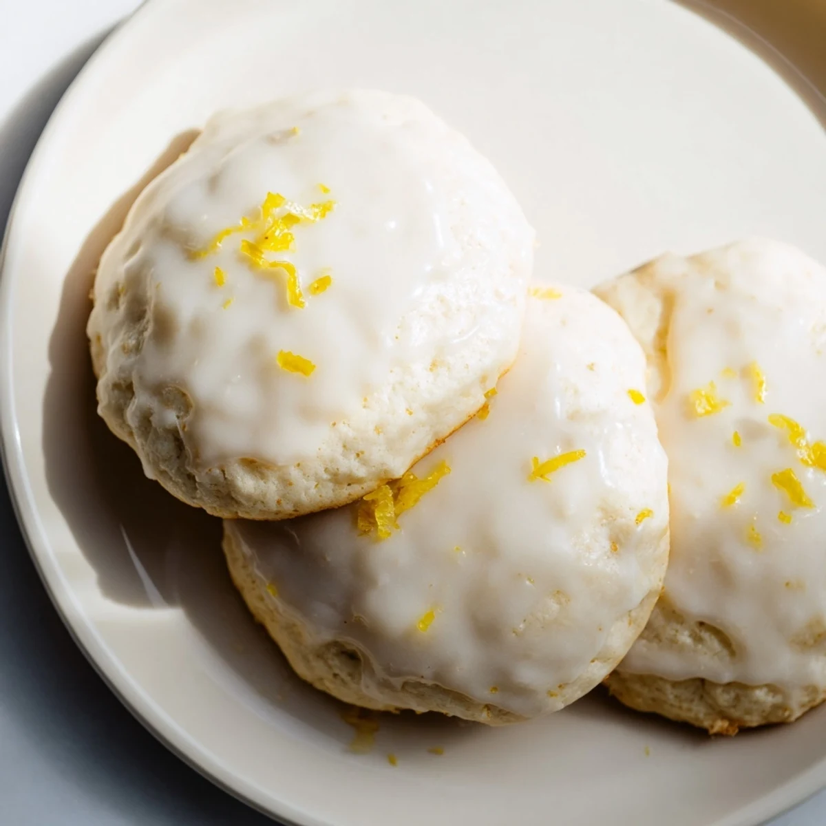Close-up of soft, pillowy Lemon Ricotta Cookies, showcasing the bright lemon flavor and texture.