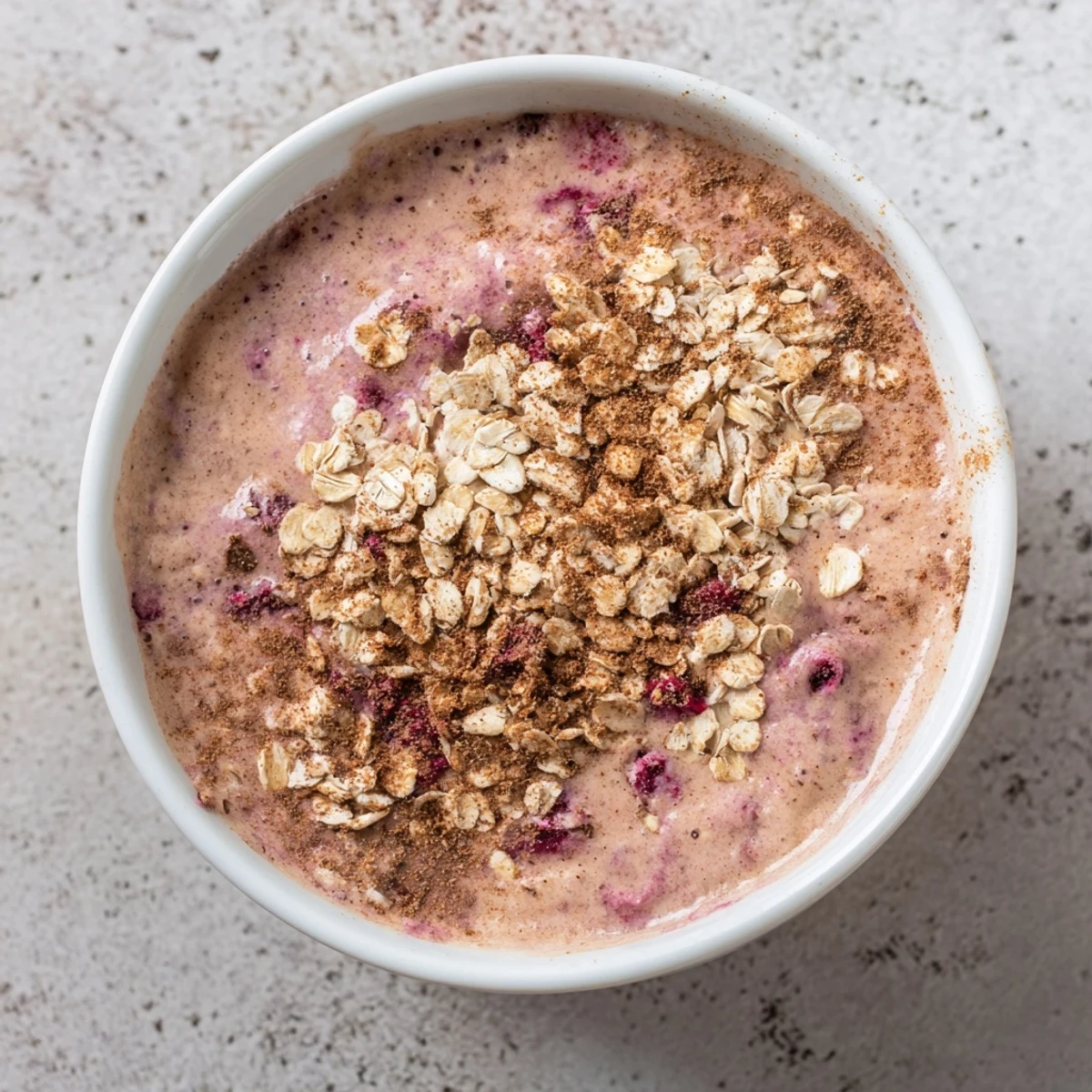 Creamy Winter Smoothie Blend poured into a glass, garnished with cinnamon and pear slices.