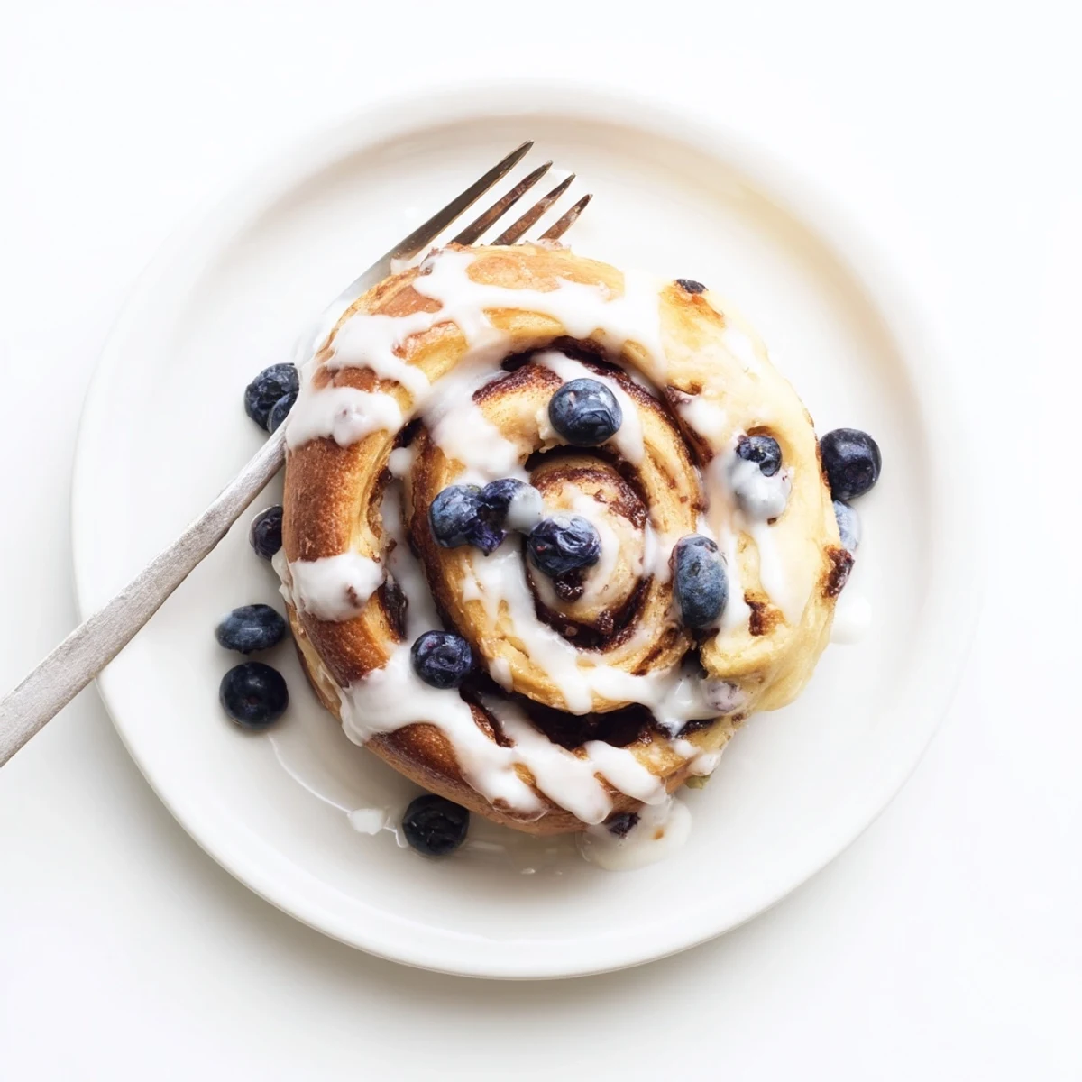 Stack of Blueberry Cinnamon Rolls with a sweet glaze, perfect for a cozy breakfast or brunch in the U.S.