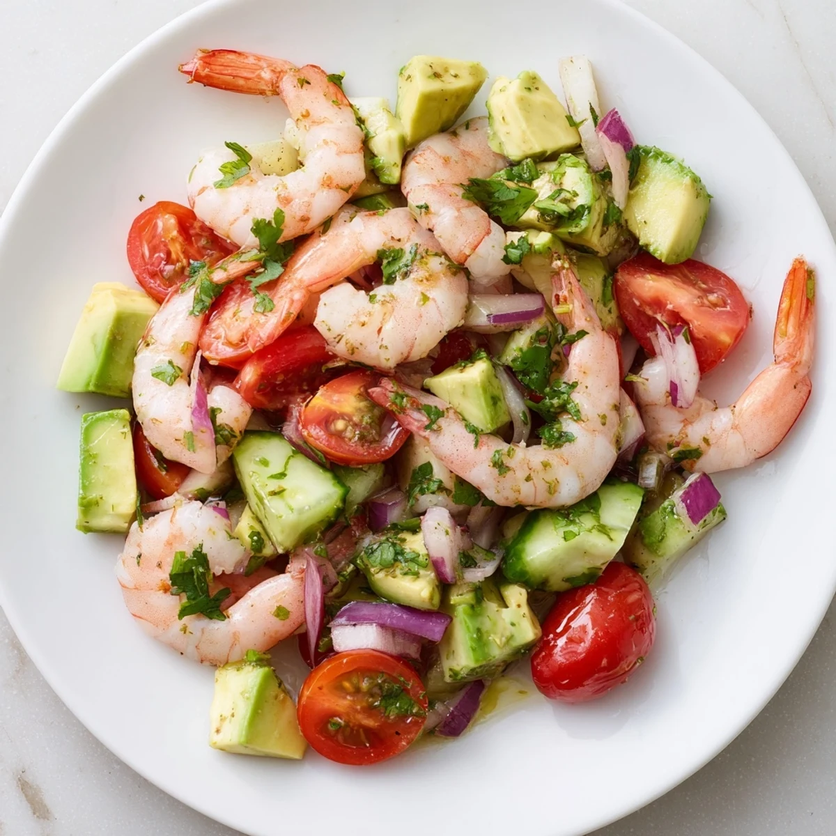 Succulent chilled shrimp and creamy avocado cubes in a zesty lime dressing, showcasing the vibrant Healthy Shrimp Avocado Salad.