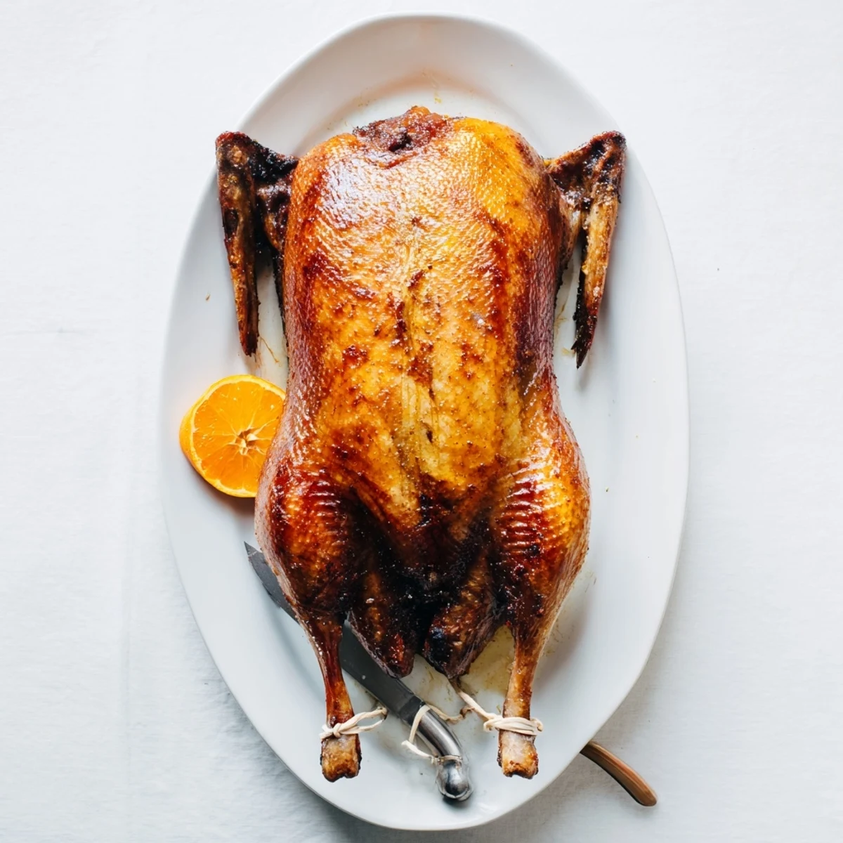 Golden five spice roasted duck with crispy amber skin and succulent juicy meat