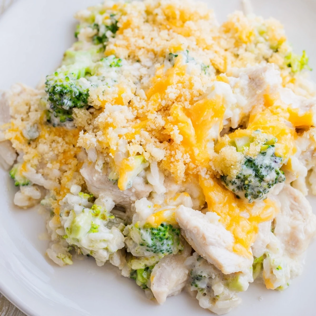 Golden chicken broccoli rice cheese casserole with melted cheddar and crispy breadcrumb topping