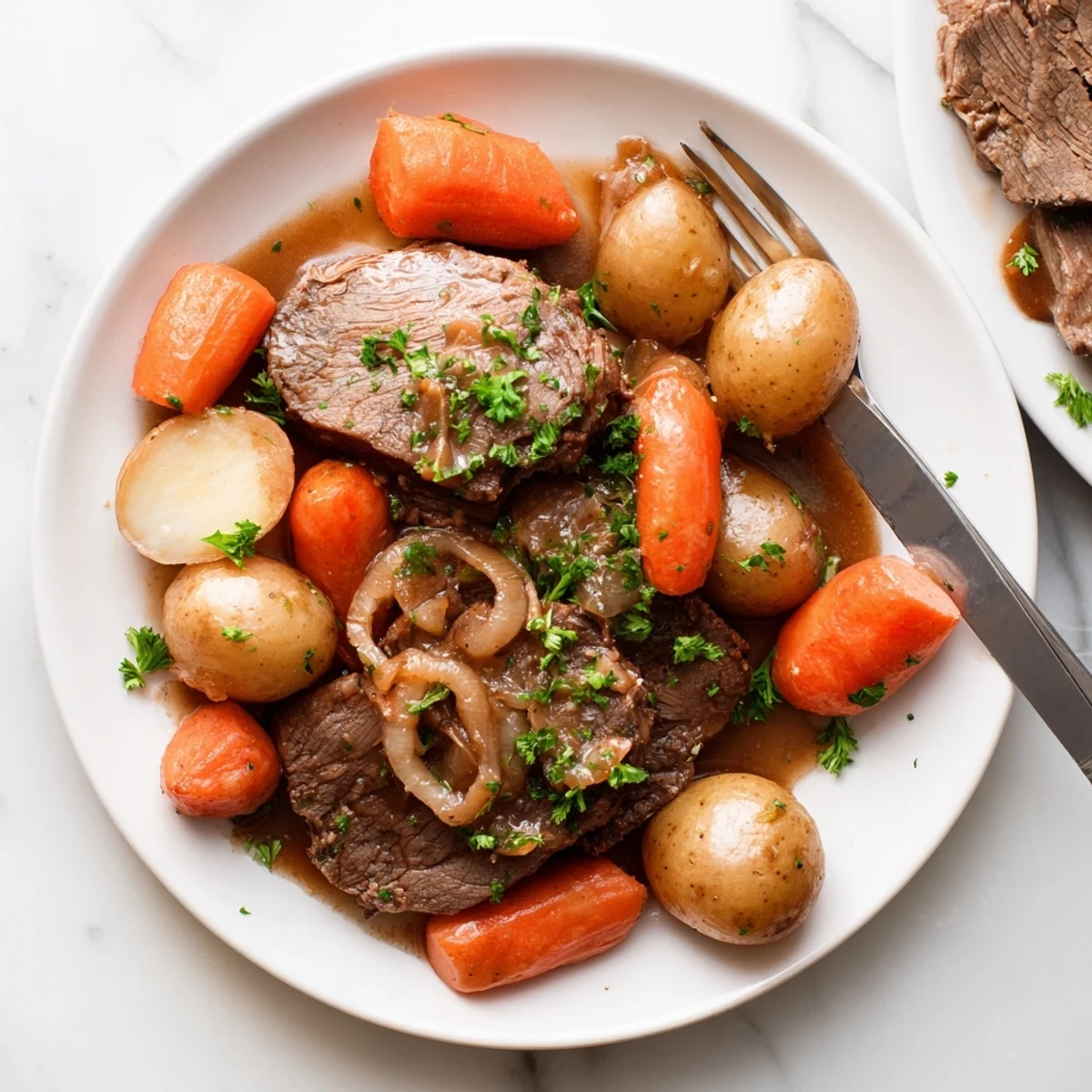 Golden-browned French onion pot roast served with melted Gruyère and fresh parsley