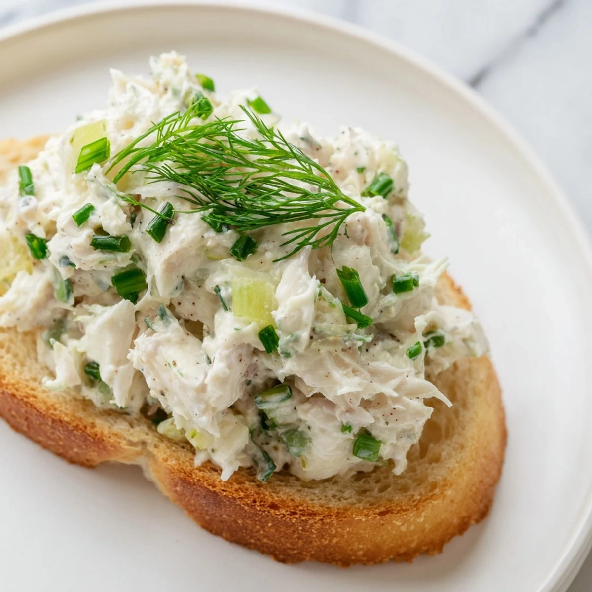 Crispy buttered toast piled high with lump crab meat and zesty herbs