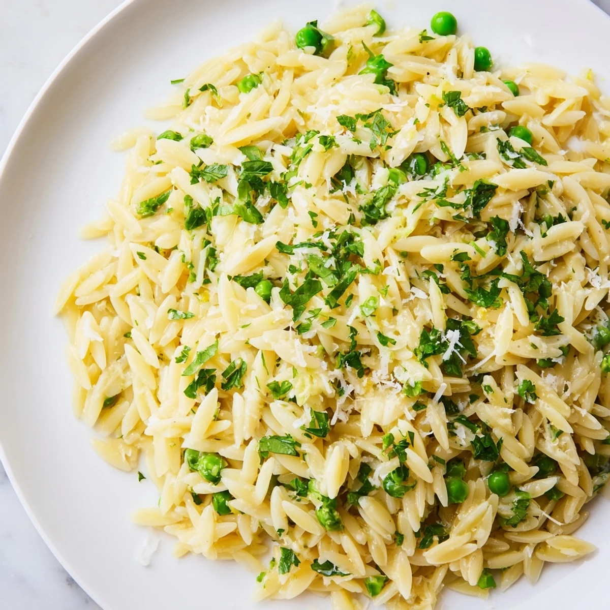 Bright lemon orzo pasta topped with fresh parsley and grated Parmesan cheese