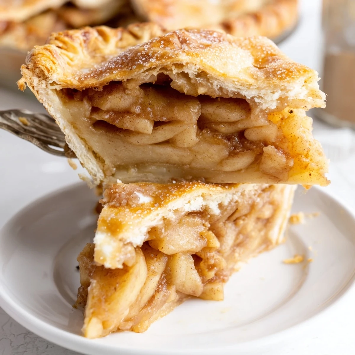 Golden apple slab pie with flaky crust bubbling with spiced apple filling