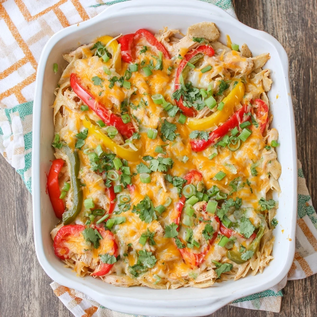 Comforting Tex-Mex cheesy chicken fajita casserole with vibrant bell peppers and golden melted cheese
