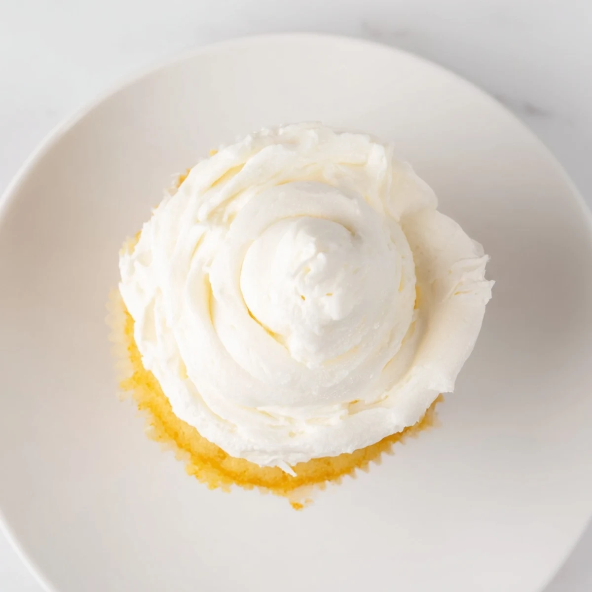 Light and fluffy vanilla cupcakes piped with smooth buttercream and decorated with colorful sprinkles for celebrations