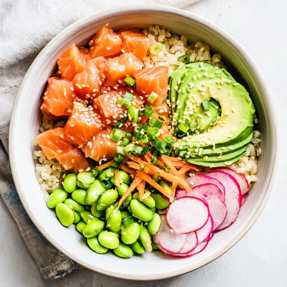 Vibrant Hawaiian-style salmon poke bowl topped with creamy avocado and crisp vegetables