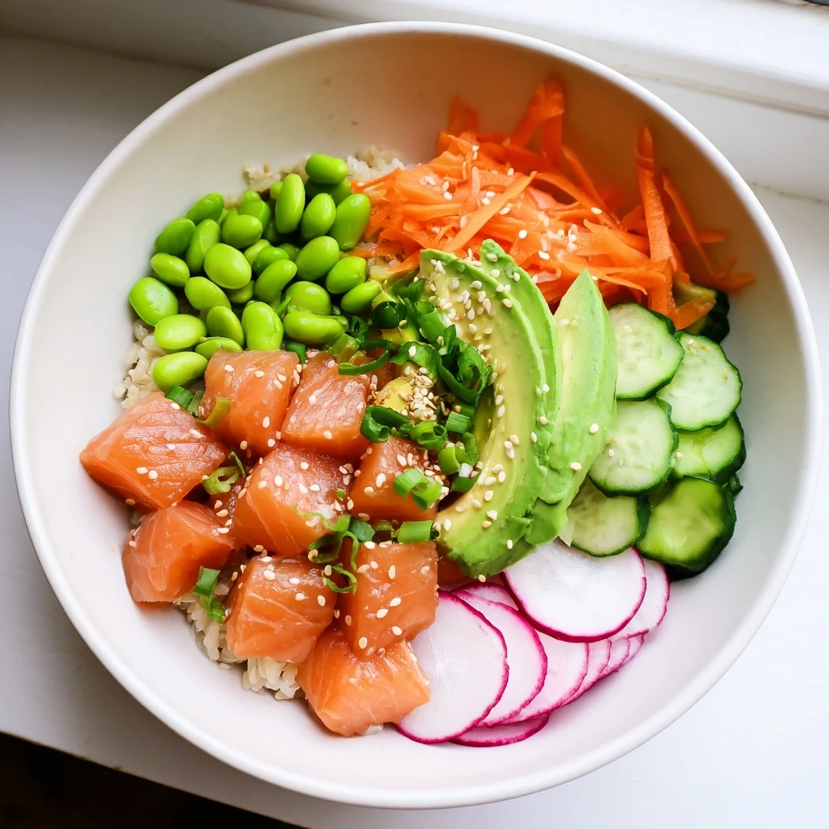 Healthy salmon and avocado poke bowl drizzled with savory sauce and sesame seeds