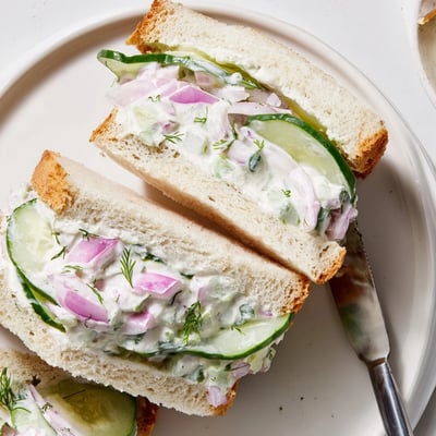 Layered Quick Cucumber Salad Sandwiches cut into halves, dill-scented, picnic-ready